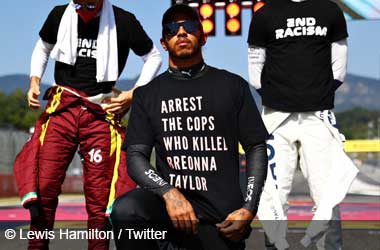Lewis Hamilton wearing "arrest the cops" t-shirt